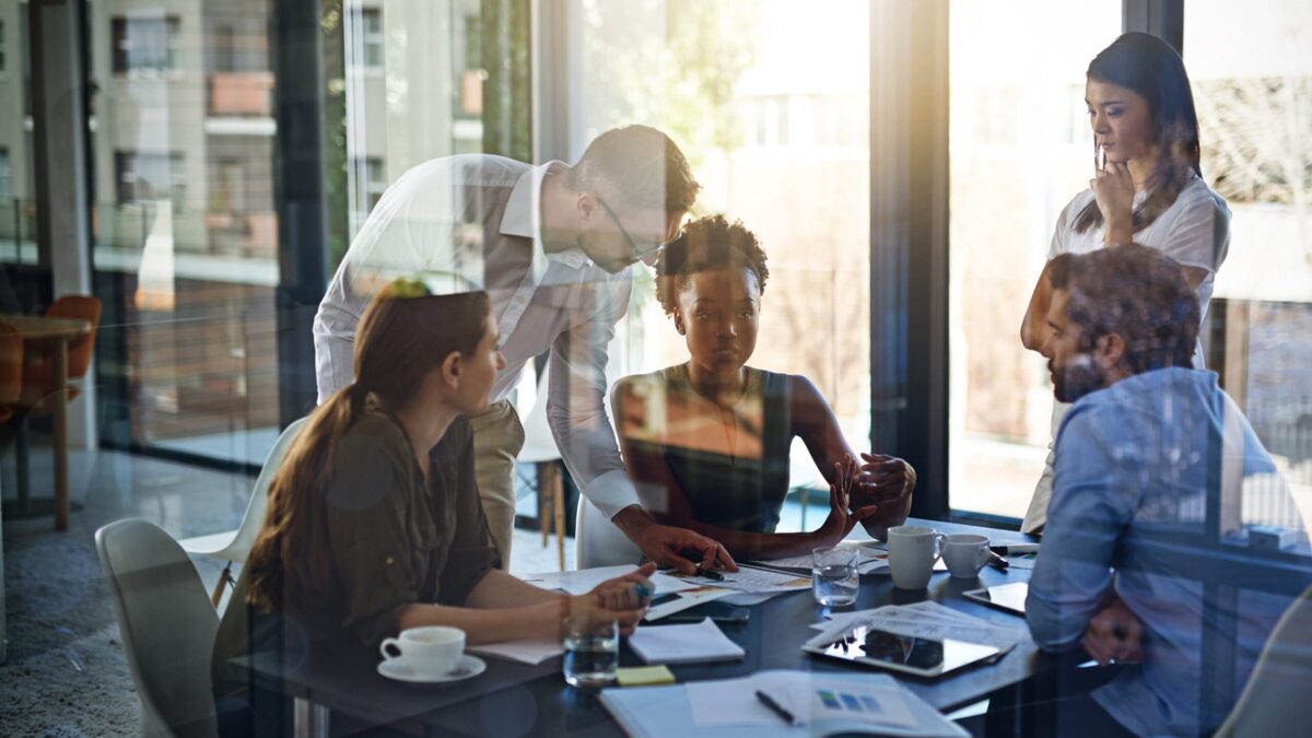 Team engaged in a dynamic boardroom discussion.